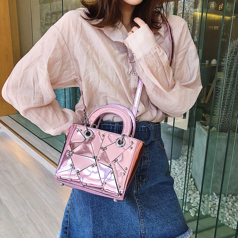 Face rivet stitching handbag
