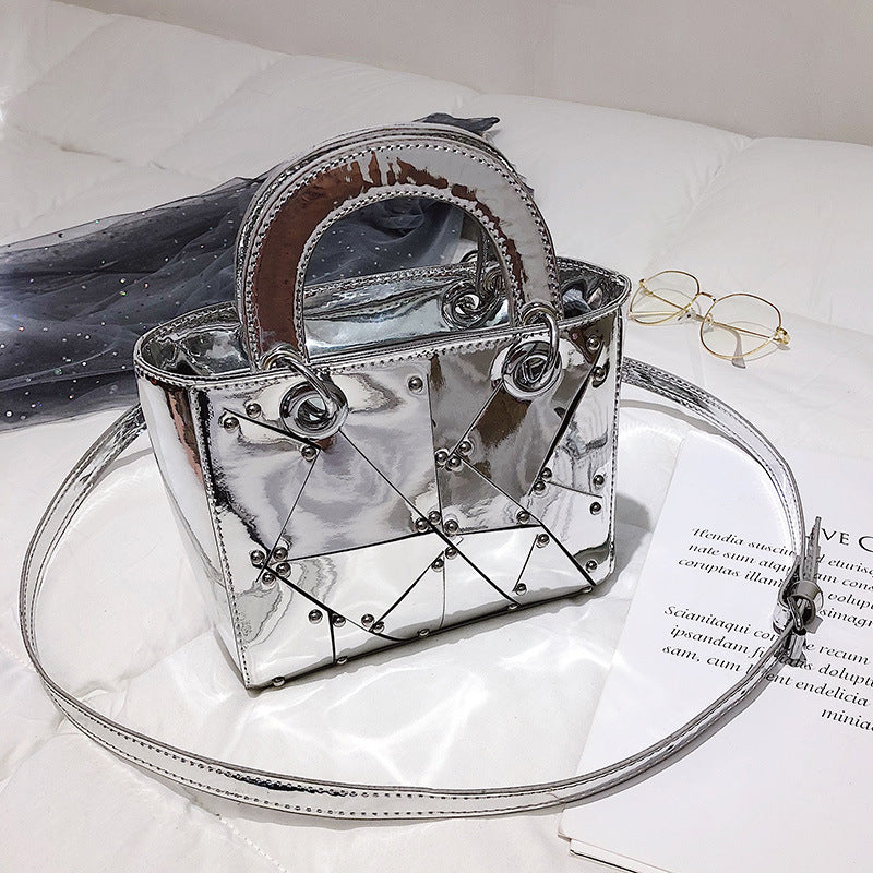 Face rivet stitching handbag